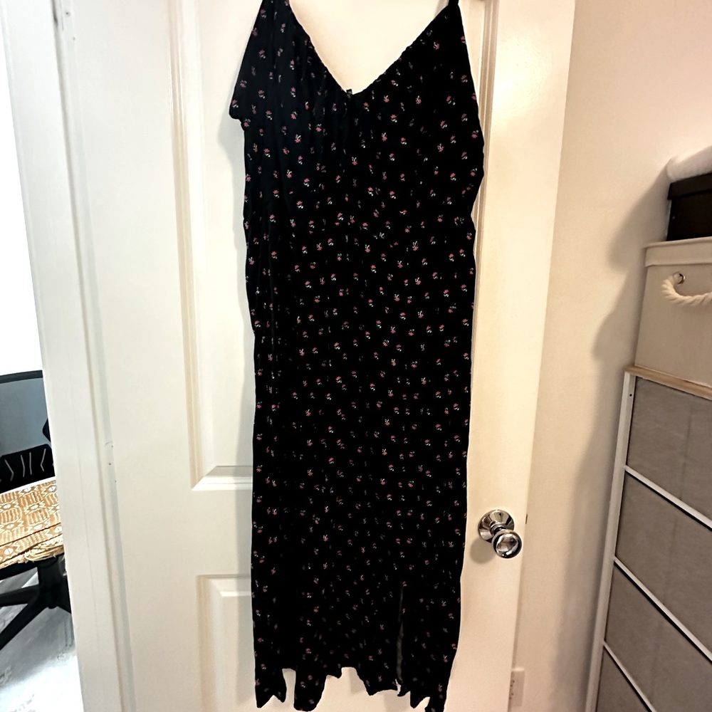 Black strap midi dress with small pink flowers, tie front, thigh slit.